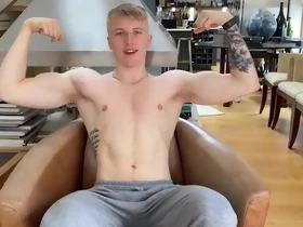 Tattooed English lad shows off his muscles on camera